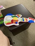 Rock & Spin Guitar Little Learner- Hours Of Fun.. Fixed Price $12.00.