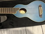 Washburn Rover Trans-blue Travel Guitar With Hard Case RO10TB. Fixed Price $200.00.
