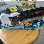 Tiger Electronics Power Tour Black Gibson Electric Guitar Toy With Dvd. Fixed Price $55.00.