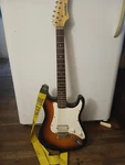 First Act Electric Guitar Brown Solid Body 6 String Right-handed W/ Strap. Fixed Price $100.00.