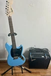 Slightly Used Electric Guitar Starter Kit Amp, Stand, Cable. Fixed Price $320.00.