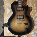Epiphone Les Paul Studio Electric Guitar Sunburst Solid Body 6 String W/ Strap. Fixed Price $210.00.