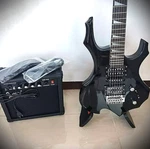 Full-size Black Electric Guitar Starter Package With 20-WATT Amp And Accessories. Fixed Price $117.99.
