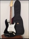 Spectrum Electric Guitar With Black Case And Shoulder Strap. Fixed Price $200.00.