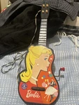 Mattel Barbie Ukulele Guitar 1960-1963 Vintage, Turn Crank, 14"X5". Fixed Price $19.00.