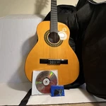 Stagg Handmade Classical Guitar C530 W/ Case, Picks & Learning Disc. Fixed Price $100.00.