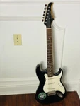Silvertone SS11 Electric Guitar With Case. Fixed Price $150.00.